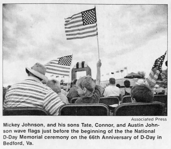 Waving flags before the beginning of D-Day Memorial